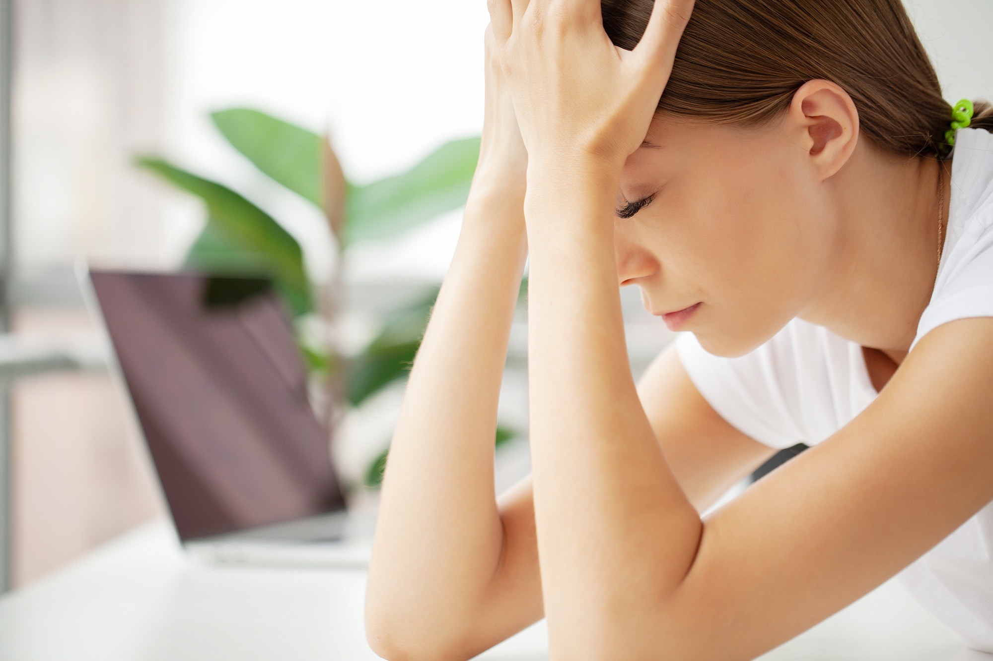 Stressed Business Woman Holding Her Head With Hand In